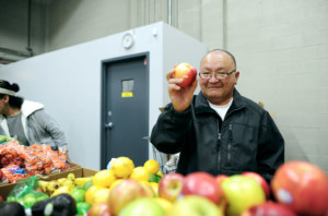 senior man shopping and holding apple