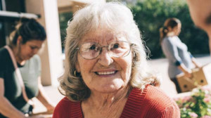 senior woman wearing sweater and glasses