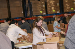 volunteers packing bags of food