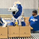 Colts mascot, Blue, helps pack boxes of food for hungry Hoosiers at Gleaners.