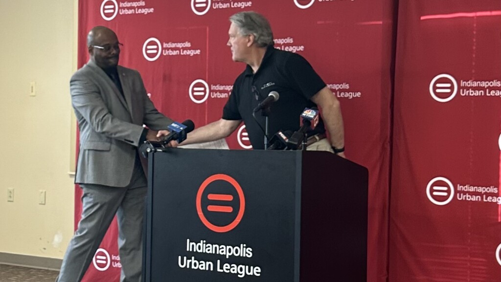 Indianapolis Urban League President & CEO Tony Mason and Gleaners President & CEO Fred Glass shake hands at the grand opening of the Urban League's food pantry.