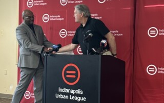 Indianapolis Urban League President & CEO Tony Mason and Gleaners President & CEO Fred Glass shake hands at the grand opening of the Urban League's food pantry.