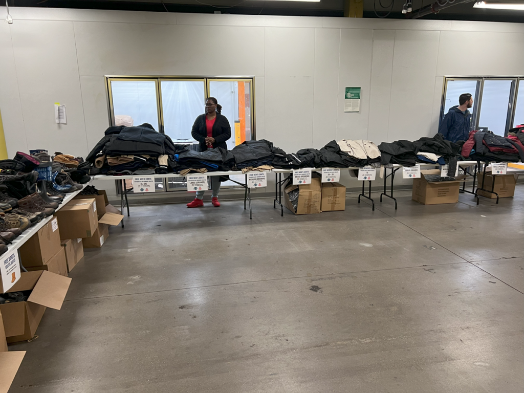 Free winter items line the tables at the resource fair