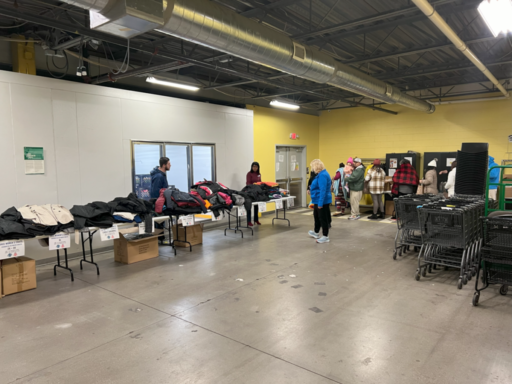 Free winter items line the tables at the resource fair