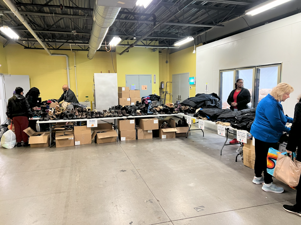 Neighbors browse free winter items available at the resource fair.