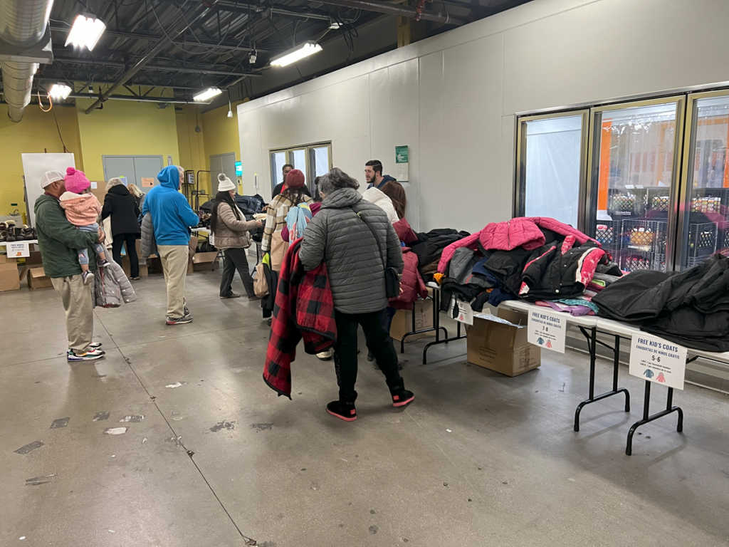 Free winter items line the tables at the resource fair