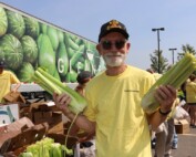 A volunteer with the Feeding Teams helps prepare food for distribution at a Hamilton County mobile pantry.